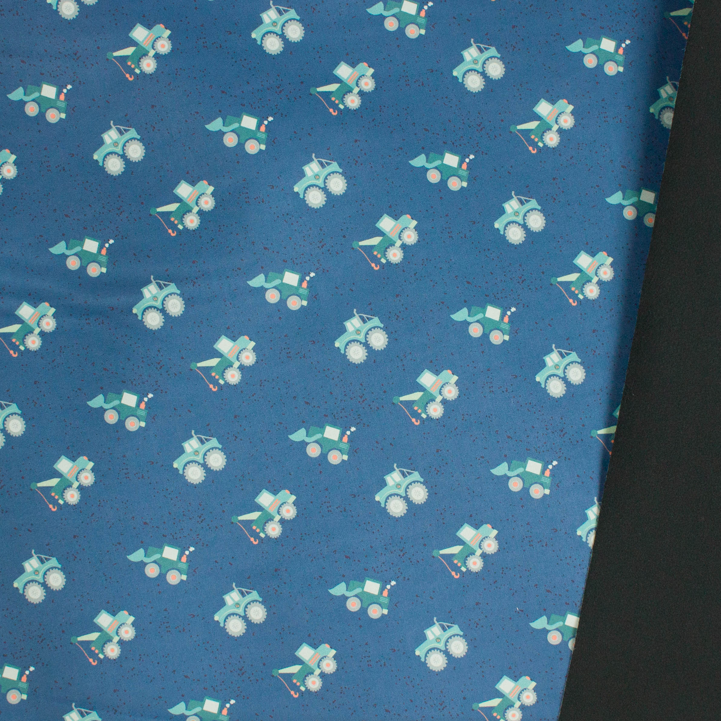 Blauwe softshell met bouwvoertuigen, zwarte fleece achterkant